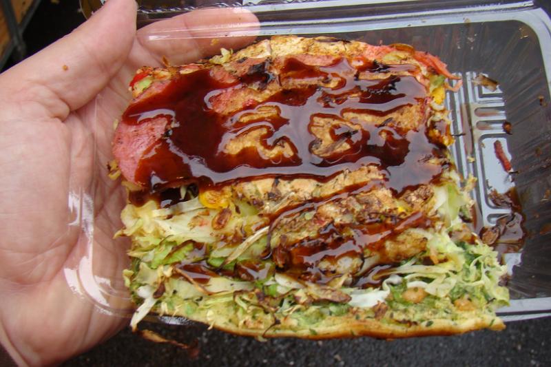 dsc01820.jpg - You smother it in Okonomiyaki sauce, which is like thick Worcester sauce.